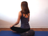 Sitting on Zafu meditation cushion